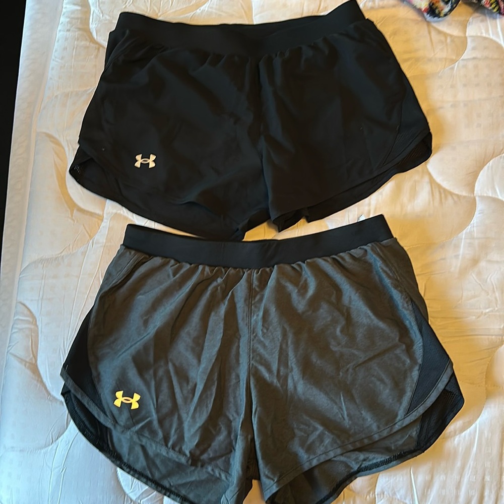 Under Amour Heat gear/ 2 pair of shorts in medium. Black / grey